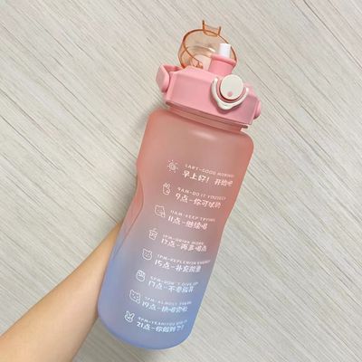 Bouteille d'eau motivationnelle avec marqueur de temps sans BPA 64OZ et conception de couleur en dégradation